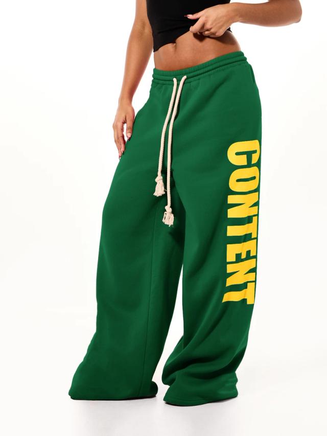green wide leg fleece sweatpants with yellow letter print
