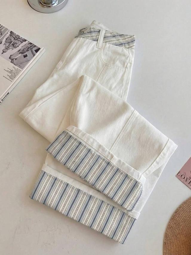 white jeans with striped patchwork detailing