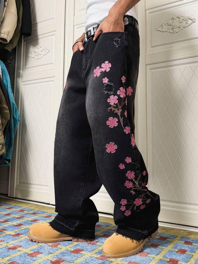 black distressed denim jeans with cherry blossom embroidery