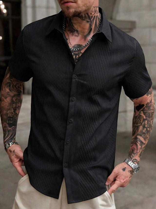 black textured short sleeve button down shirt