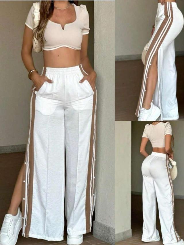 white wide leg trousers with brown side stripe detail