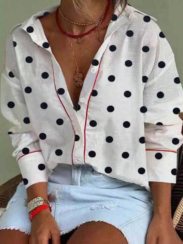 elegant polka dot blouse with contrasting red trim