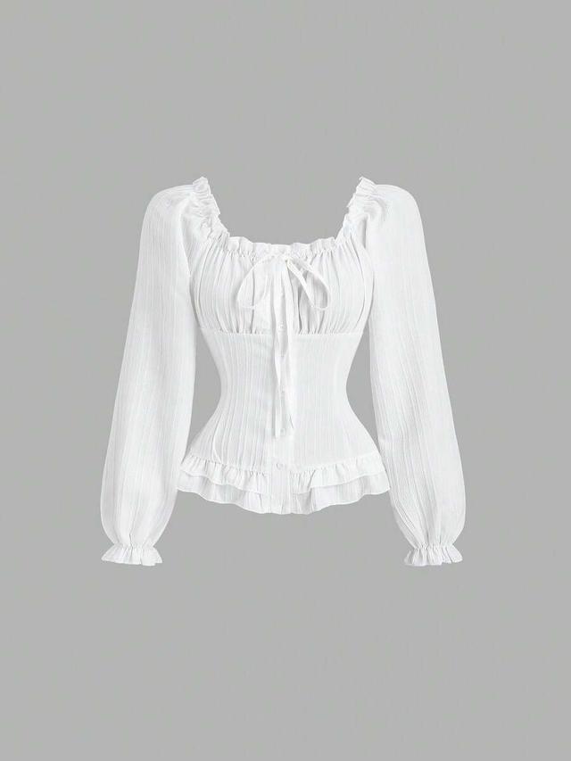 white textured long sleeve cinched waist ruffle blouse