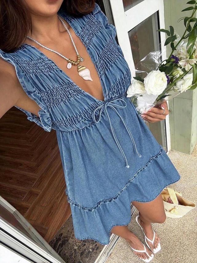 denim smocked mini dress with ruffled hem