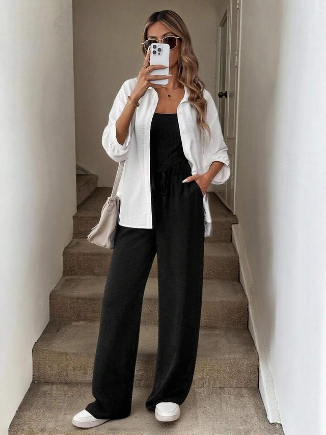 white button-up shirt with black wide-leg trousers