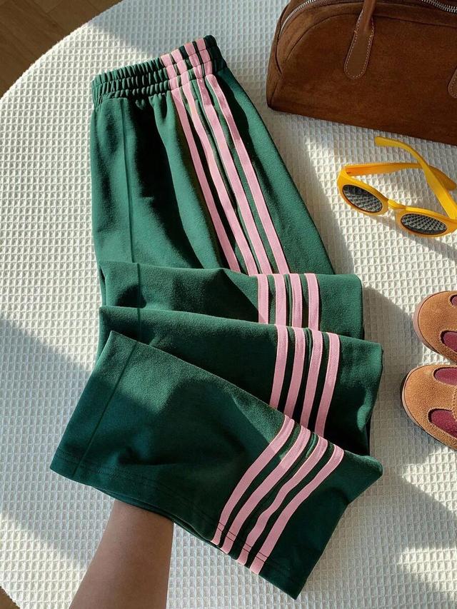 green wide leg sweatpants with pink side stripes