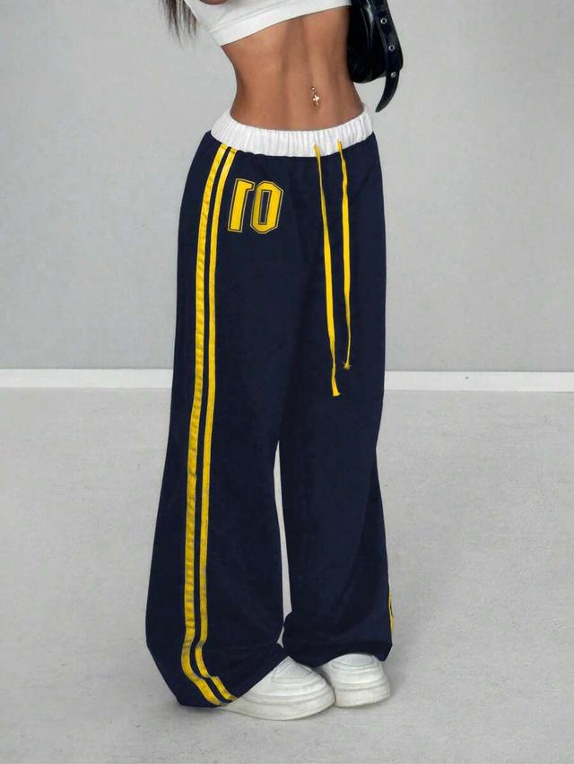 navy blue retro sports sweatpants with numeric print