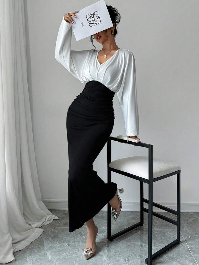 two-tone draped white blouse and black ruched skirt dress