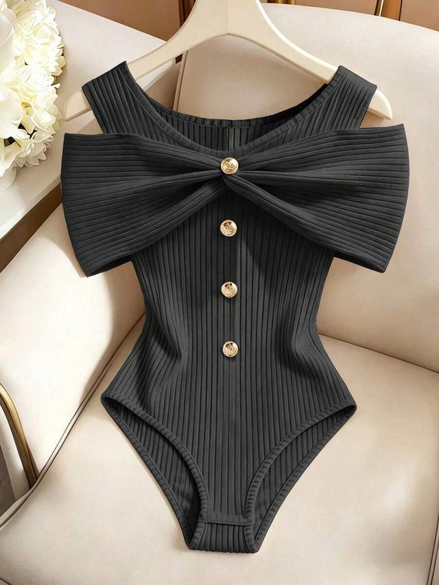 black ribbed sleeveless bodysuit with pleated detail
