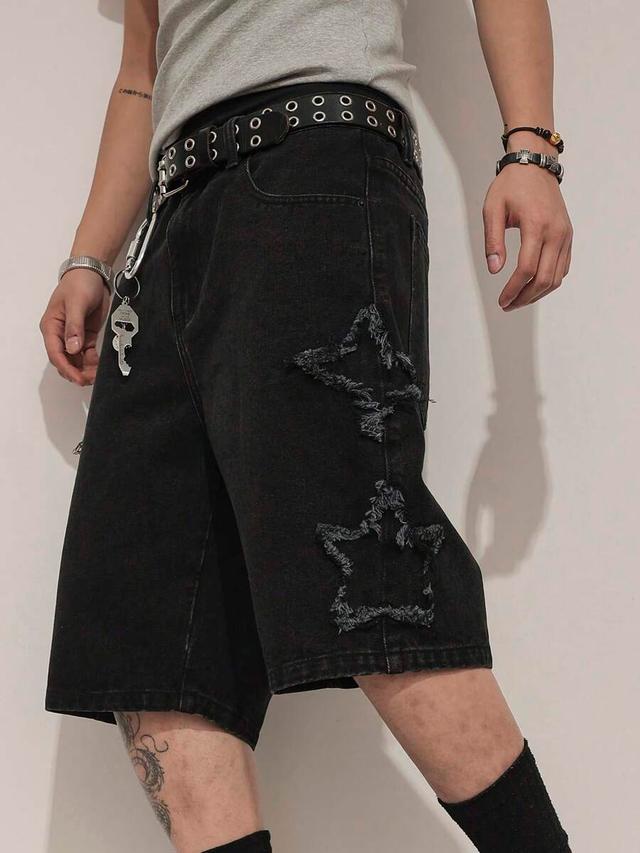 black denim shorts with distressed star pattern