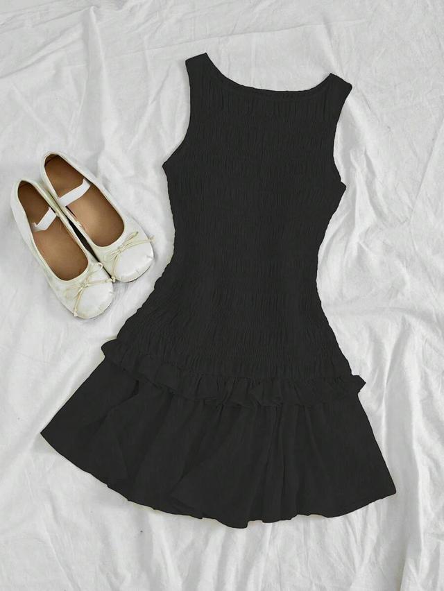 solid black smocked sleeveless mini dress with ruffle hem