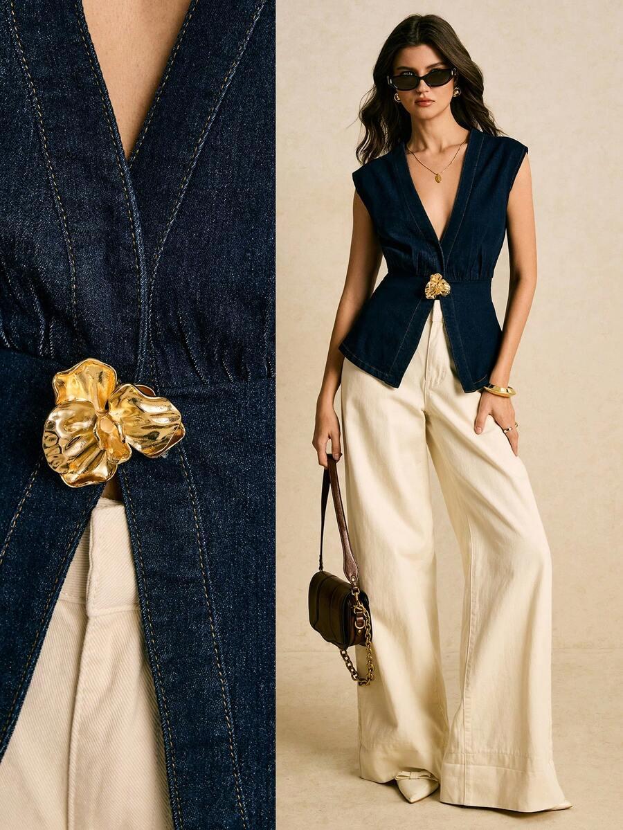 dark wash denim sleeveless vest with floral metal clasp