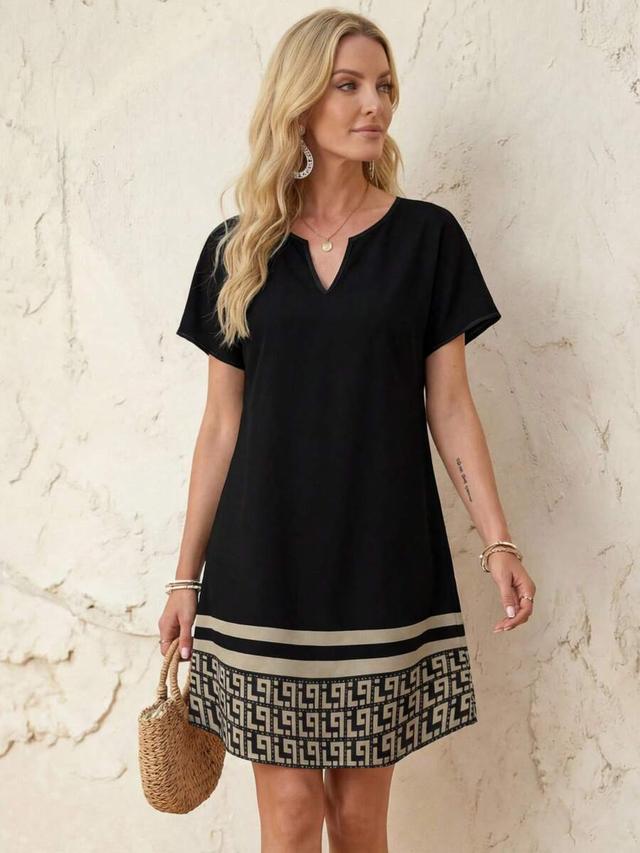 minimalist black v-neck short dress with geometric hem