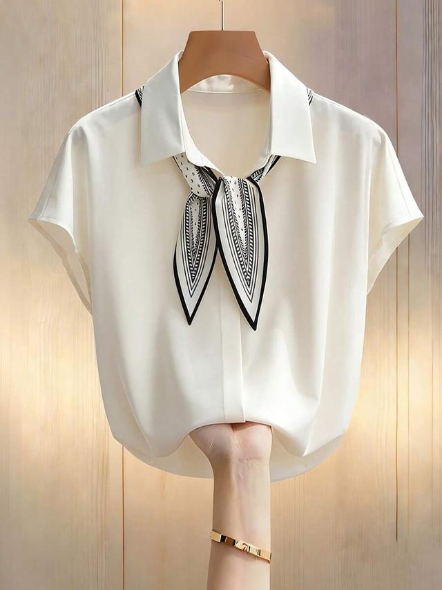 beige chiffon v-neck blouse with bat print tie