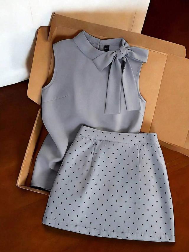 sleeveless turtleneck bow top and mini skirt set