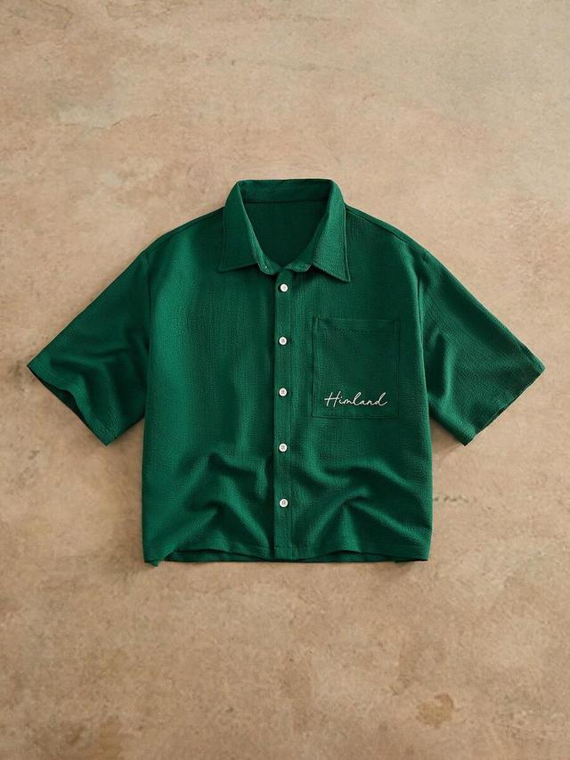 green woven short sleeve button up shirt