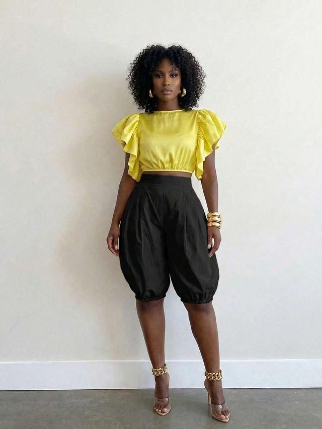 black high-waisted pleated lantern midi shorts