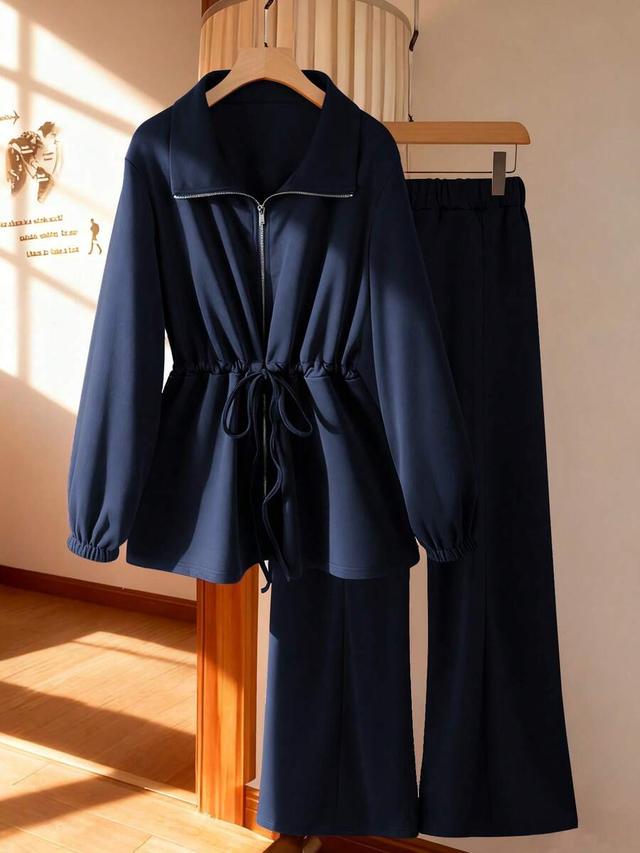 navy blue high collar cinched waist zip-up set