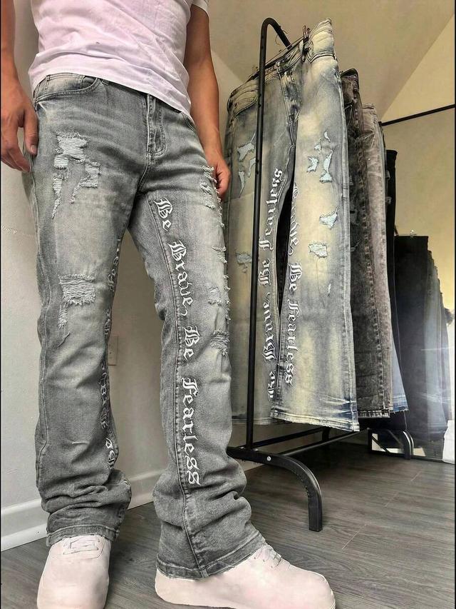 embroidered distressed flared washed denim jeans