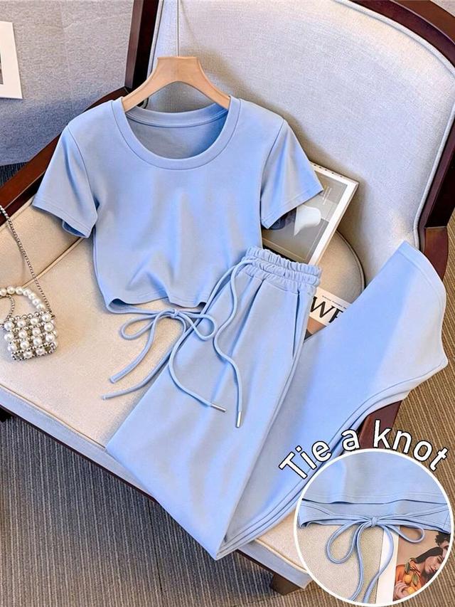 light blue round neck short sleeve tie-waist top