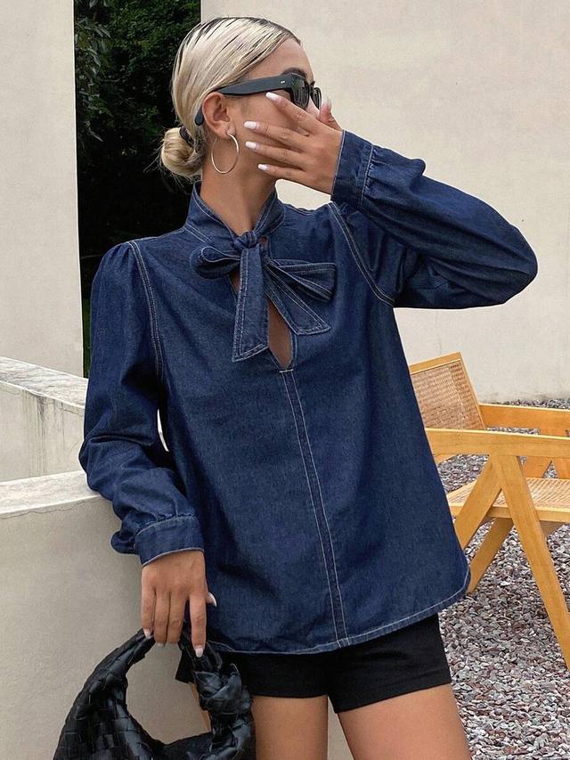 dark wash denim puff sleeve tie neck blouse