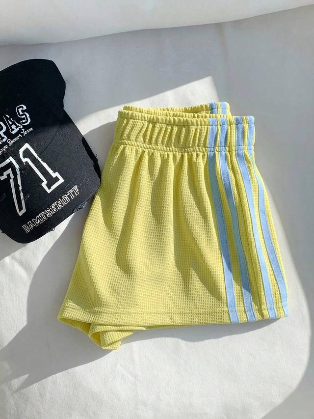 yellow waffle knit shorts with contrast blue side stripes