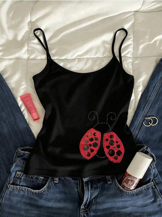 black spaghetti strap cami with ladybug button appliqué