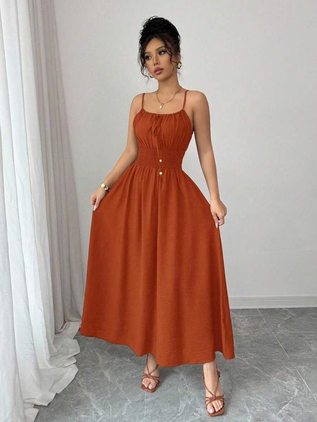 coffee-color linen sleeveless pleated dress with waist bow
