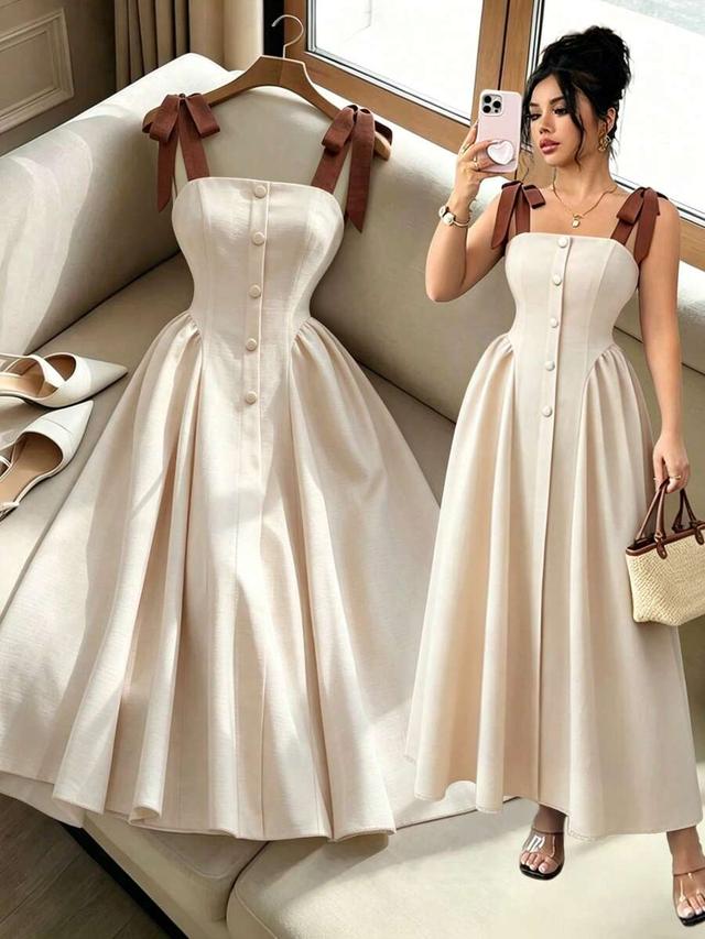 cream linen midi dress with brown tie straps