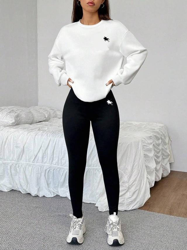 white crew neck sweatshirt with embroidered logo
