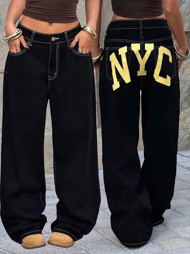 black wide-leg jeans with contrast stitching and letter print