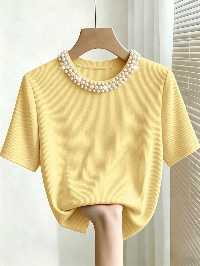 yellow ribbed round neck t-shirt with pearl embellishment
