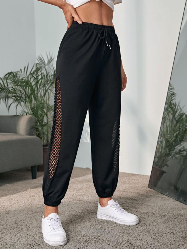 black drawstring sweatpants with fishnet side inserts