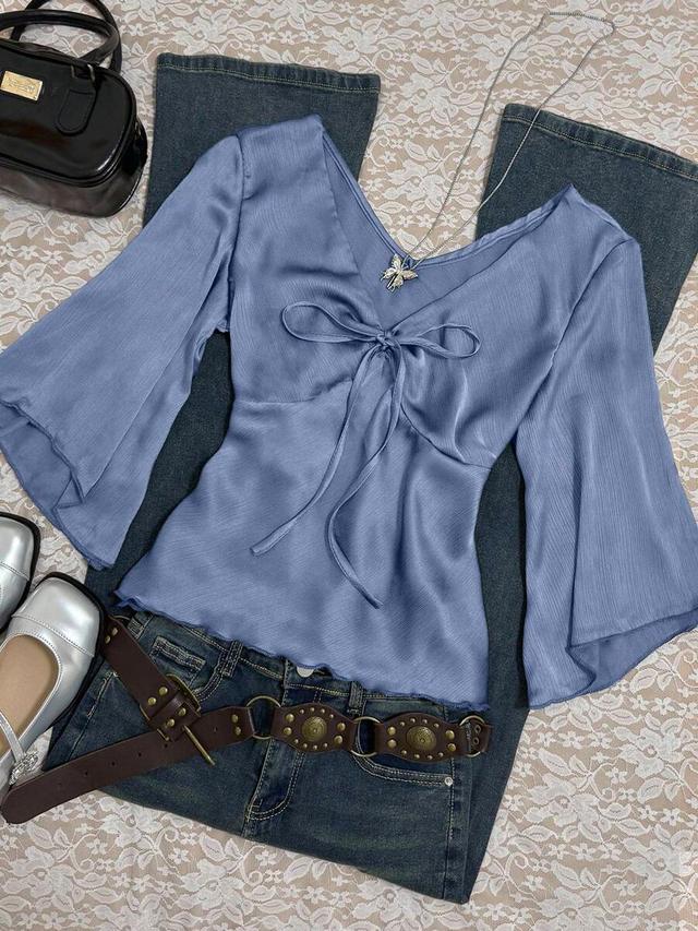 blue satin v-neck tie-front blouse with flared sleeves