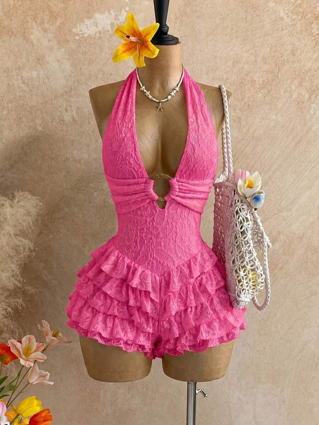 hot pink textured halter romper with ruffled hem