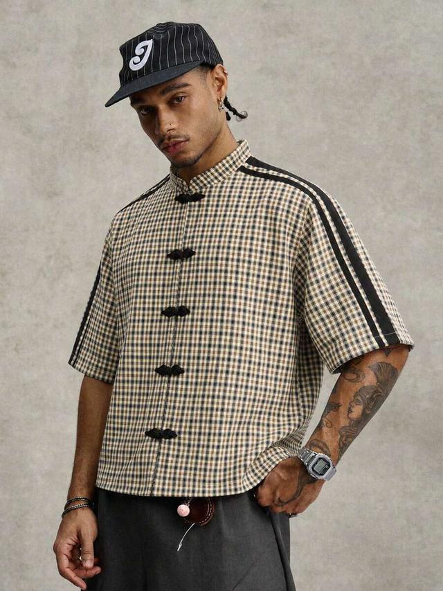 beige plaid short sleeve shirt with frog closures