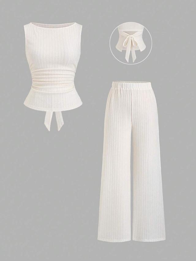 white ribbed boat neck top and flare pants set