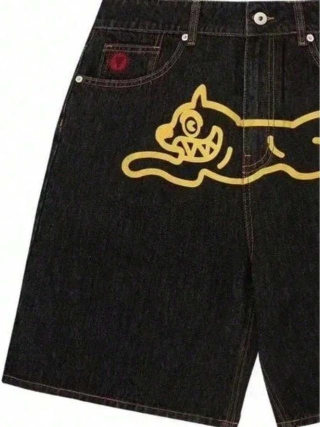 black denim shorts with yellow flying dog graphic