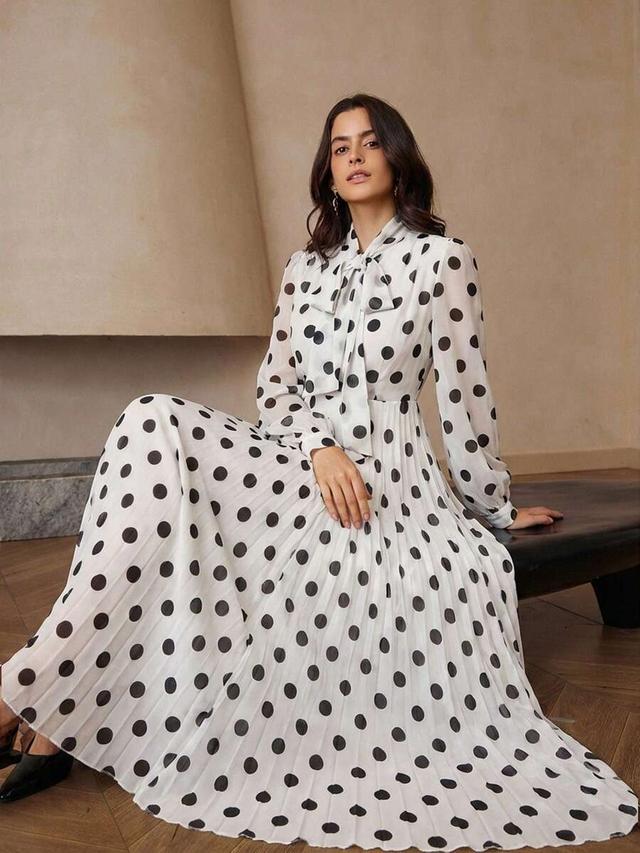 white polka dot long sleeve pleated waist dress