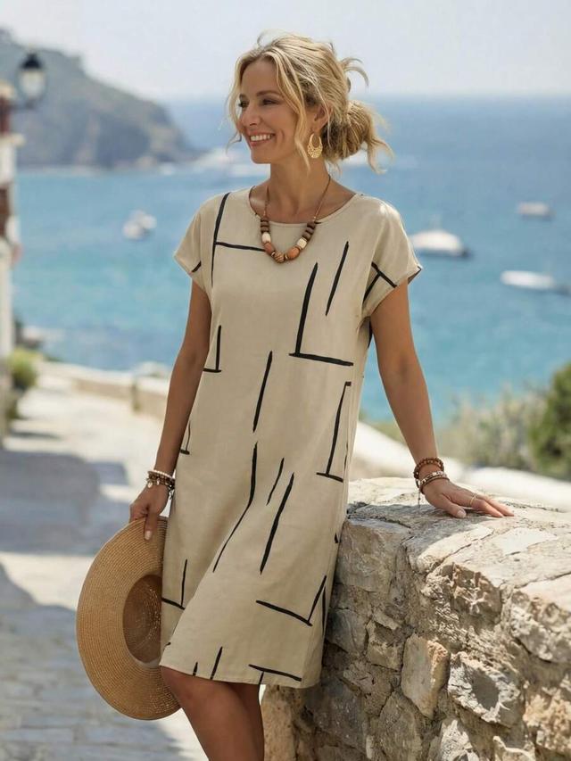 beige linen shift dress with black abstract print
