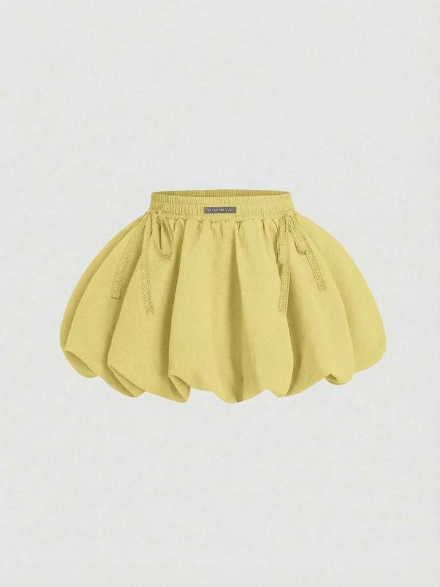 solid yellow low waist ruffle hem bubble skirt