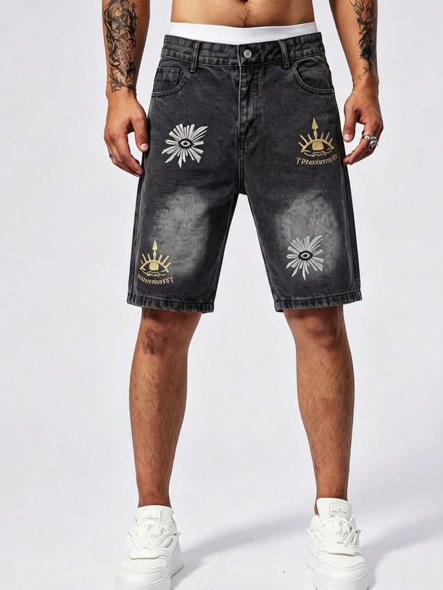 men's black denim shorts with embroidered eye motifs