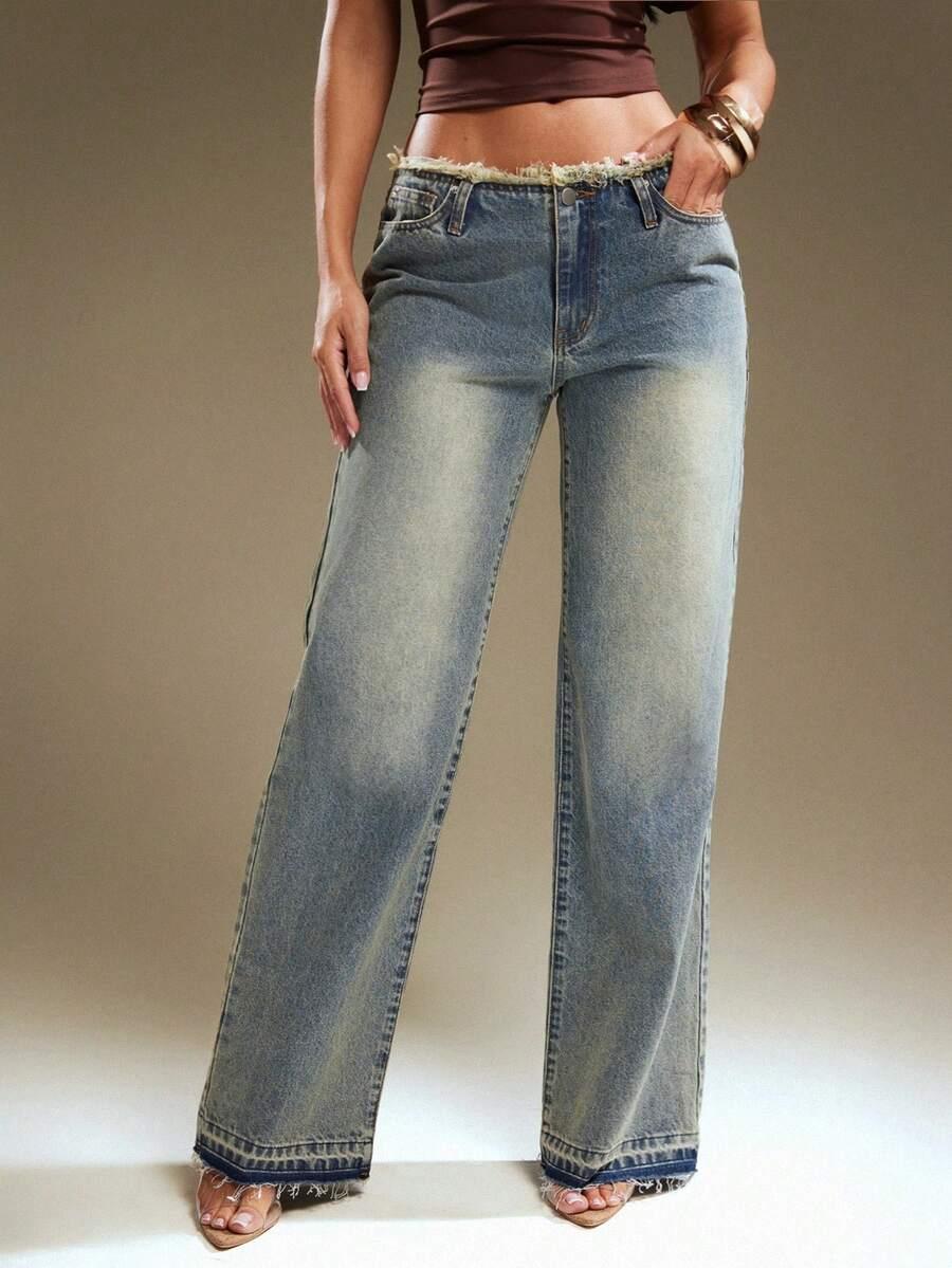 light wash denim jeans with raw frayed hem