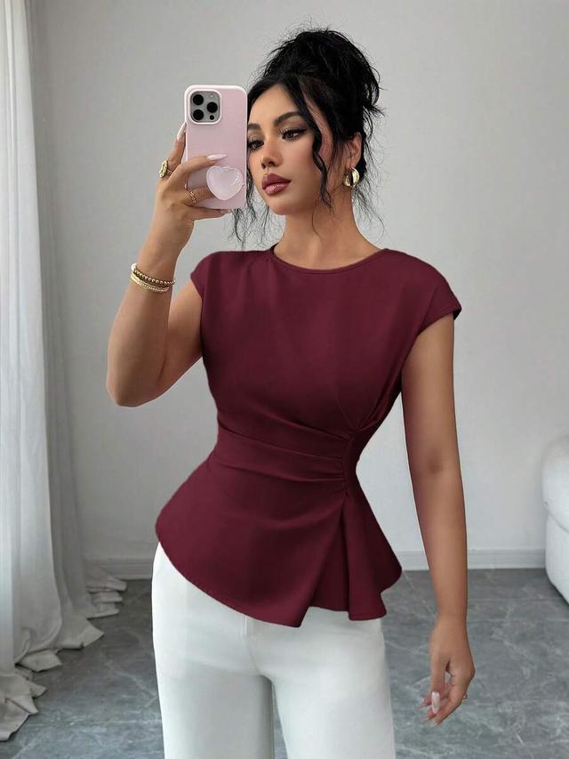 burgundy waist cinched flared hem sleeveless blouse
