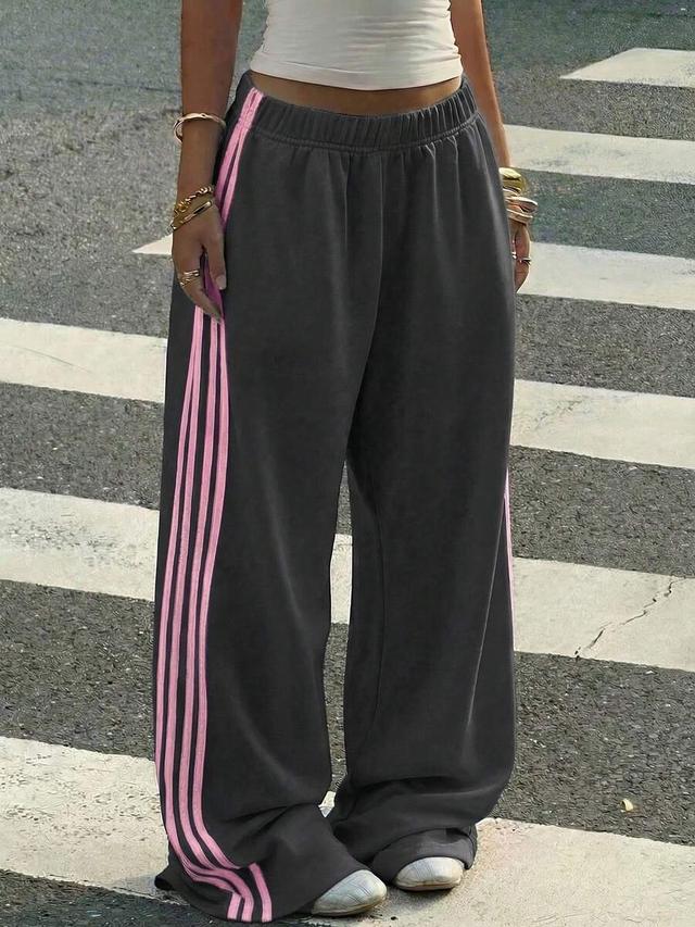 dark grey loose casual sweatpants with pink side stripes