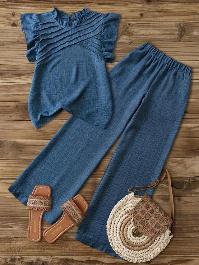 aqua blue ruched cap sleeve shirt and straight leg pants