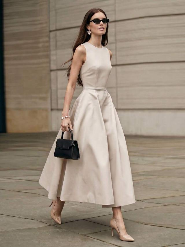 elegant beige sleeveless waist-cinched midi dress