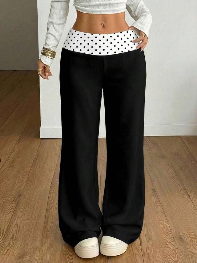 black rib knit black flare trousers with polka dot waistband