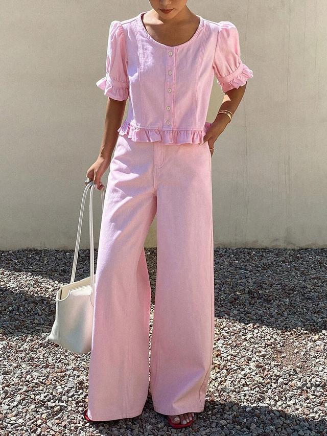 pink ruffle hem blouse and loose denim pants
