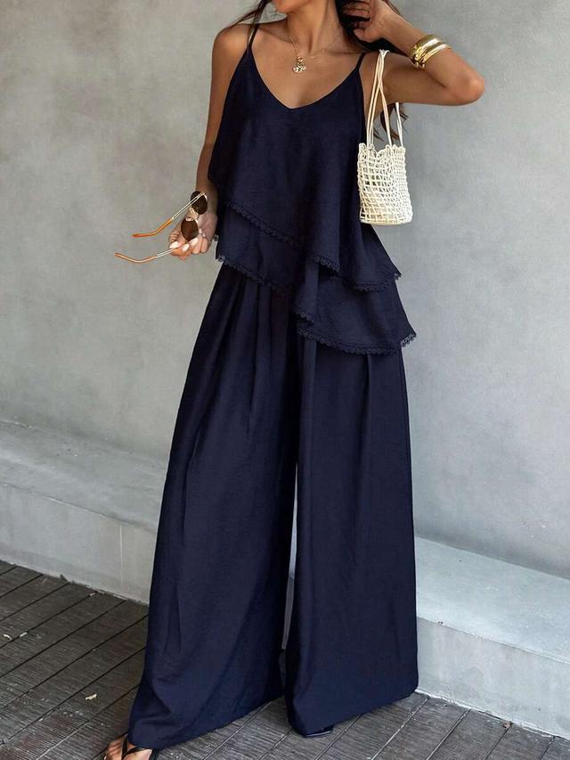 navy blue ruffled camisole top and loose solid pants